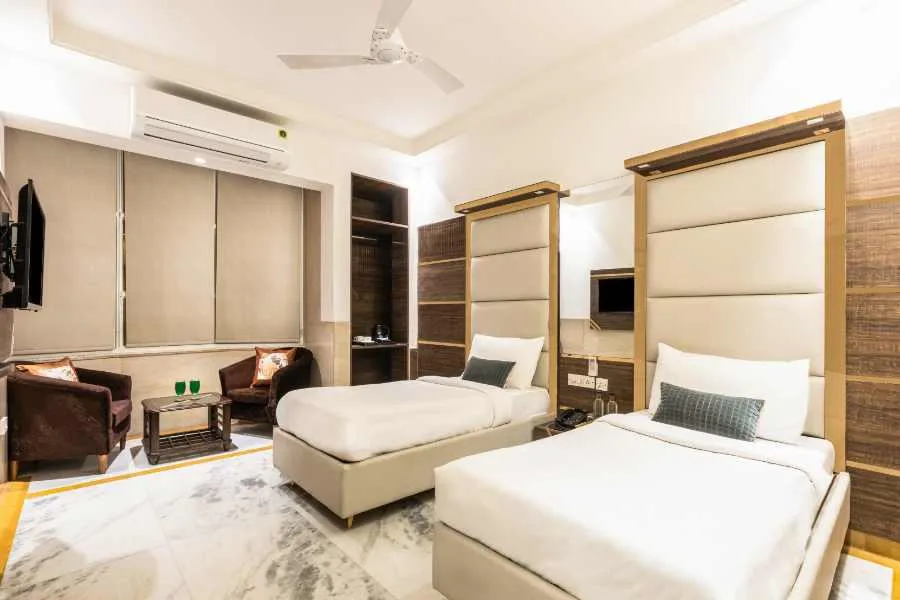 Comfortable twin-bed hotel room for senior citizens in Gujarat